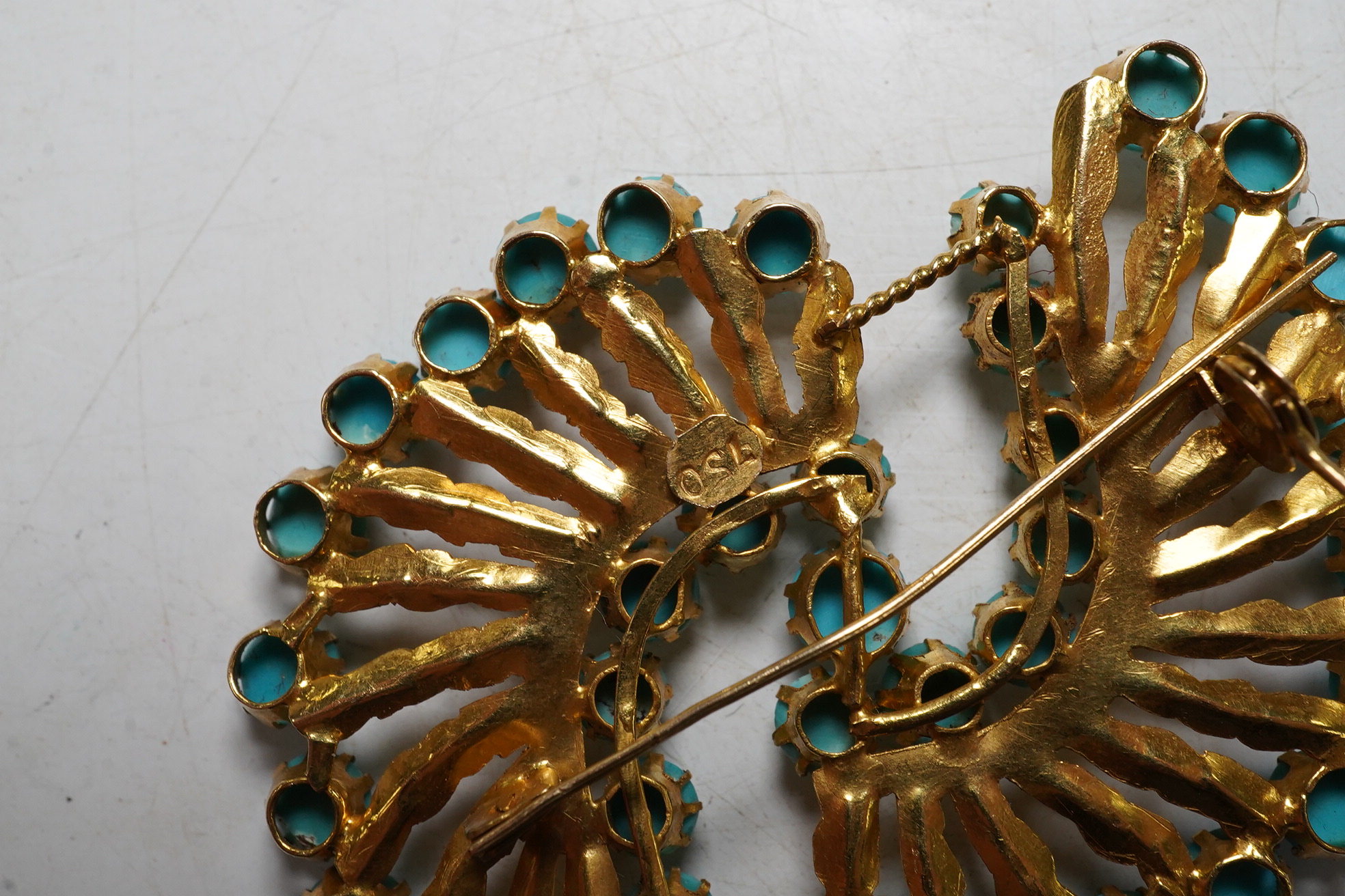 An 18ct gold and turquoise dress ring, gross 7.3 grams, and a turquoise set brooch stamped 750, gross 10.5 grams Condition - fair.